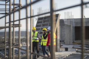 construction workers at an outdoor worksite on a hot day